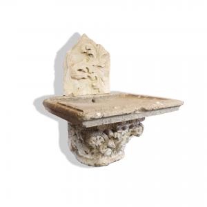 Antique stone wall fountain. 17th century.